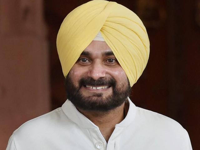 Navjot Singh Sidhu comes out of Parliament House after resigning from Rajya Sabha as Member of Parliament, on the first day the monsoon session in New Delhi.(PTI Photo)