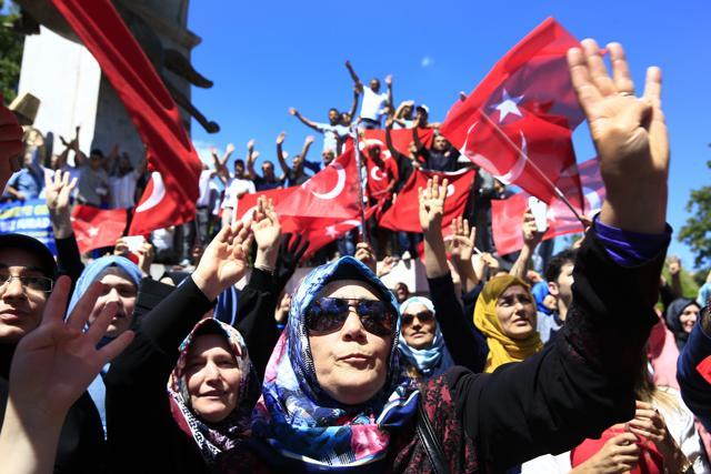 Pro-government supporters chant slogans and wave Turkish flags as they protest against the attempted coup, in Istanbul, Tuesday, July 19, 2016. (AP Photo) Pro-government supporters chant slogans and wave Turkish flags as they protest against the attempted coup, in Istanbul, Tuesday, July 19, 2016. (AP Photo)