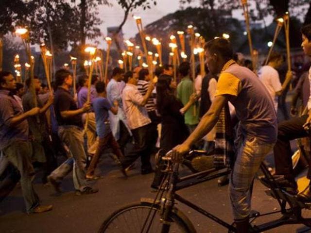 Demonstrators take part in a candlelight march in Dhaka to demand justice for liberal bloggers attacked of their writings.(AP File) Demonstrators take part in a candlelight march in Dhaka to demand justice for liberal bloggers attacked of their writings.(AP File)