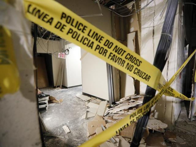 Bomb blast damage and gunshot damage is seen in a hallway at El Centro College.(AP Photo)