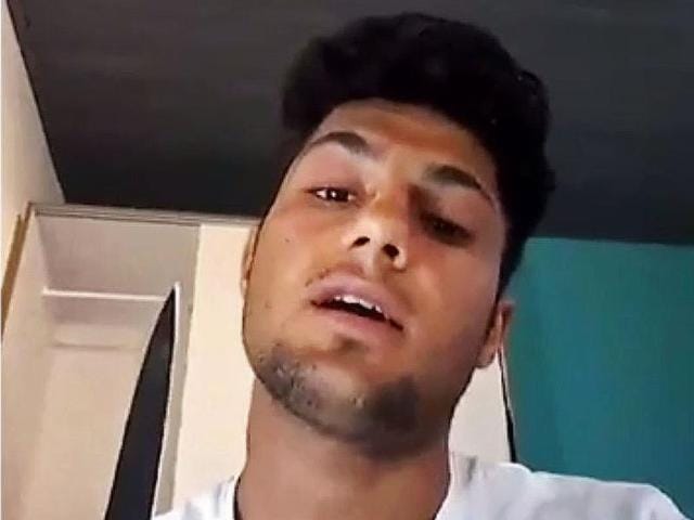 This still image taken from an undated video posted on The Aamaq news agency purports to show a 17-year-old asylum-seeker who attacked people with an axe and knife on a train in southern Germany. (AP Photo) This still image taken from an undated video posted on The Aamaq news agency purports to show a 17-year-old asylum-seeker who attacked people with an axe and knife on a train in southern Germany. (AP Photo)
