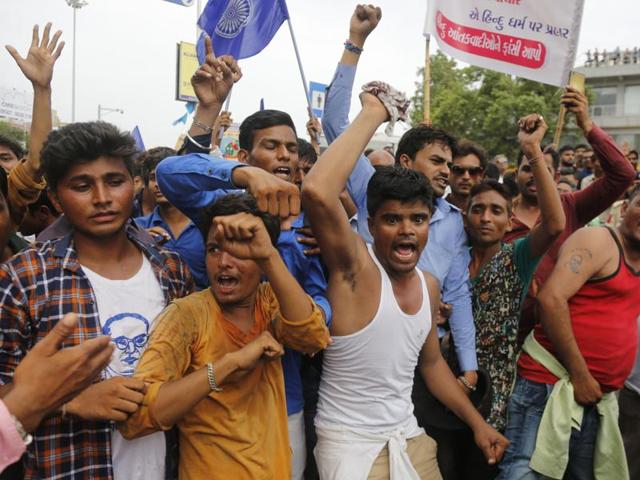 Dalits protest against the alleged attack on community members for skinning a cow in Una, in Ahmedabad.(AP Photo)