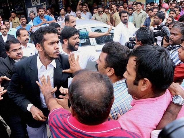 Lawyers attacking media persons during their protest march in front of Kerala high court in Kochi on Wednesday. (PTI) Lawyers attacking media persons during their protest march in front of Kerala high court in Kochi on Wednesday. (PTI)