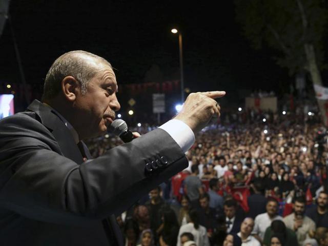 Turkey's President Recep Tayyip Erdogan addresses his supporters gathered in front of his residence in Istanbul on early Tuesday. (AP) Turkey's President Recep Tayyip Erdogan addresses his supporters gathered in front of his residence in Istanbul on early Tuesday. (AP)