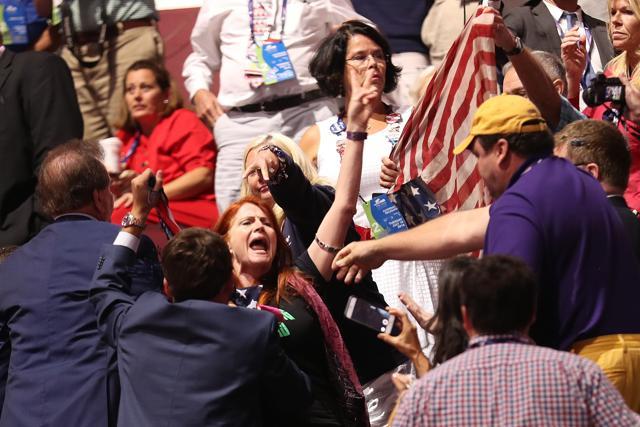 A member of the activist group Code Pink demonstrates during former Republican presidential candidate Ben Carson's speech on the second day of the Republican National Convention at the Quicken Loans Arena in Cleveland, Ohio. Republican presidential candidate Donald Trump received the number of votes needed to secure the party's nomination. (AFP) A member of the activist group Code Pink demonstrates during former Republican presidential candidate Ben Carson's speech on the second day of the Republican National Convention at the Quicken Loans Arena in Cleveland, Ohio. Republican presidential candidate Donald Trump received the number of votes needed to secure the party's nomination. (AFP)