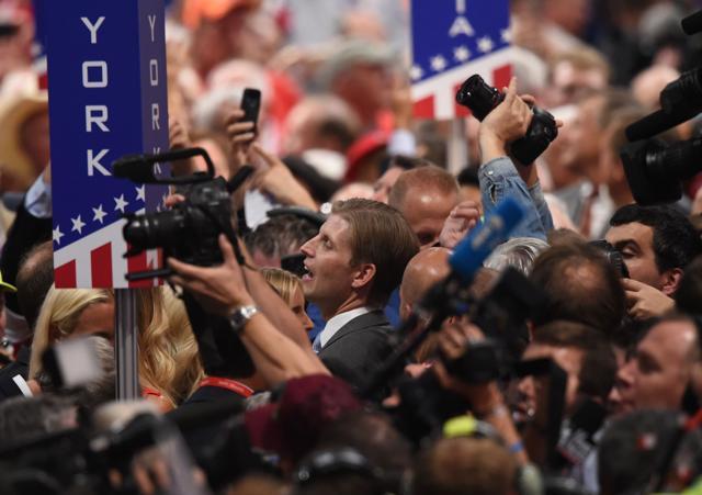 Eric Trump (centre), son of Republican presidential candidate Donald Trump, arrives on the floor of the Republican National Convention in Cleveland on Tuesday. The Republican Party formally nominated Donald Trump for president of the US, capping a rollercoaster campaign that saw the billionaire defeat 16 rivals. (AFP) Eric Trump (centre), son of Republican presidential candidate Donald Trump, arrives on the floor of the Republican National Convention in Cleveland on Tuesday. The Republican Party formally nominated Donald Trump for president of the US, capping a rollercoaster campaign that saw the billionaire defeat 16 rivals. (AFP)
