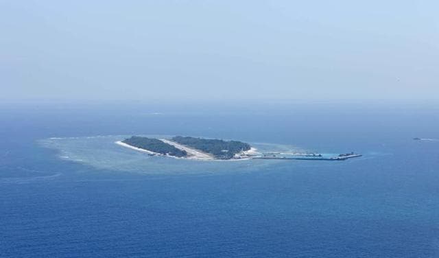 An aerial photo taken though a glass window of a Taiwanese military plane shows the view of Itu Aba. (Reuters Photo)