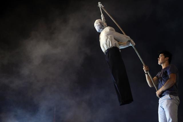 A Pro-Erdogan supporter holds an effigy of US based cleric Fetullah Gulen hanged by a noosed on during a rally at Taksim square in Istanbul on Monday. (AFP) A Pro-Erdogan supporter holds an effigy of US based cleric Fetullah Gulen hanged by a noosed on during a rally at Taksim square in Istanbul on Monday. (AFP)