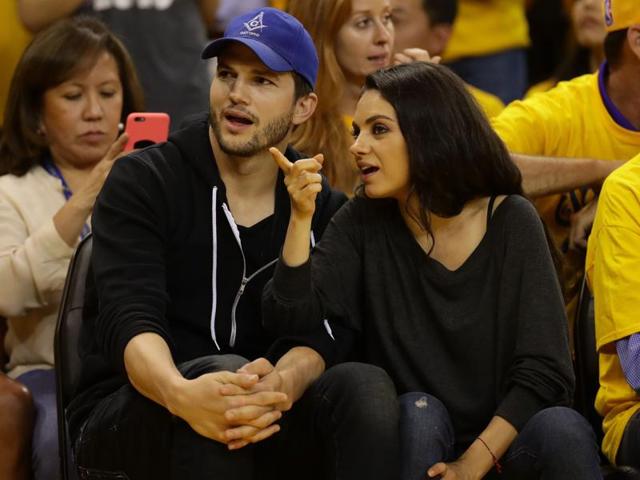 Actors Ashton Kutcher and Mila Kunis attend the 2016 NBA Finals. (AFP) Actors Ashton Kutcher and Mila Kunis attend the 2016 NBA Finals. (AFP)