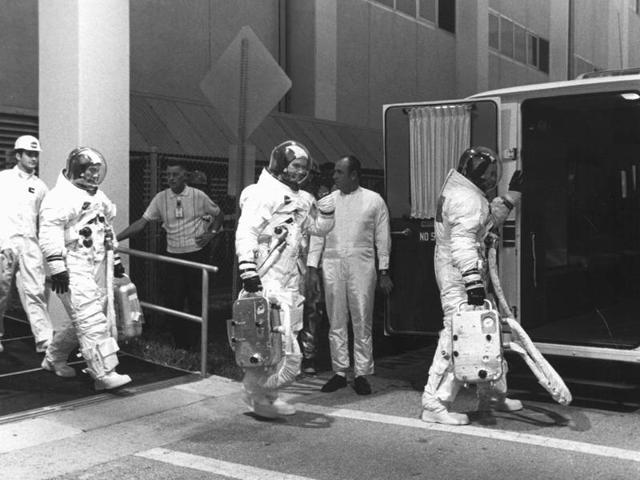 Three astronauts were selected for the audacious mission -- command module pilot Michael Collins, mission commander Neil A Armstrong, and lunar module pilot Edwin “Buzz” E Aldrin, Jr. This image shows them suited up for a countdown demonstration test on July 16, 1969.  (NASA) 