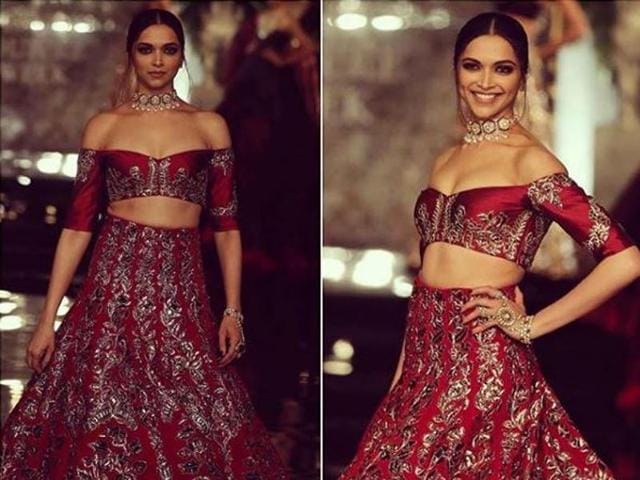 Deepika pulled out all the stops in her crimson off-shoulder lehenga. Deeper shades of plum and maroons, heavy detailing and embellishments, cut-out backs and elaborate trains on lehengas made up Malhotra’s showcase. (Instagram) 