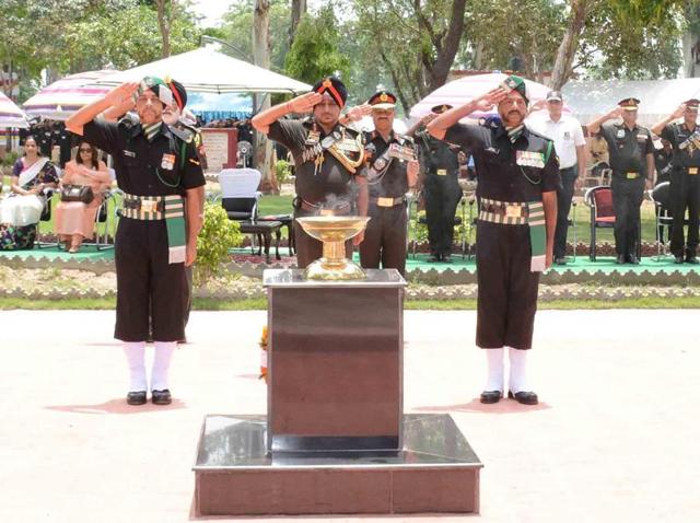 Lieutenant General KJ Singh (centre), general officer commanding-in-chief of the Western Command, paying tributes to martyrs during the inauguration of a war memorial at Cheema village, close to the border, in Tarn Taran district on Wednesday. (HT Photo) Lieutenant General KJ Singh (centre), general officer commanding-in-chief of the Western Command, paying tributes to martyrs during the inauguration of a war memorial at Cheema village, close to the border, in Tarn Taran district on Wednesday. (HT Photo)