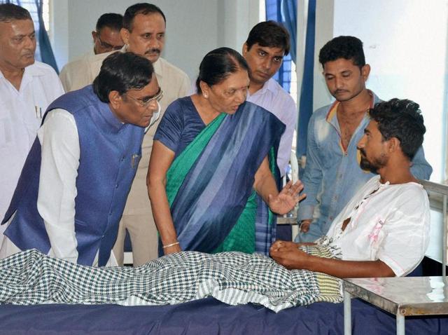 Gujarat chief minister Anandiben Patel on Wednesday visits one of the Dalit youth who was assaulted by ‘cow vigilantes’ in Rajkot.(PTI Photo)