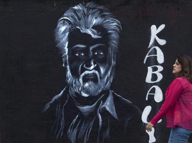 Portrait of Thalaivar : A fan looks at a sketch of Rajinikanth at Juhu in Mumbai on Thursday. (Satish Bate/HT photo) Portrait of Thalaivar : A fan looks at a sketch of Rajinikanth at Juhu in Mumbai on Thursday. (Satish Bate/HT photo)