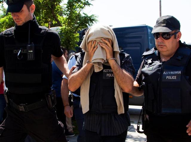 One of the eight Turkish soldiers who fled to Greece in a helicopter and requested political asylum after a failed military coup against the government, is escorted to the courthouse of the northern city of Alexandroupolis in Greece. (Reuter) One of the eight Turkish soldiers who fled to Greece in a helicopter and requested political asylum after a failed military coup against the government, is escorted to the courthouse of the northern city of Alexandroupolis in Greece. (Reuter)