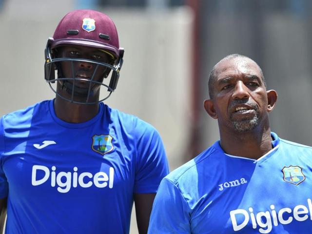 West Indies cricket team captain Jason Holder (L) listens to his team coach Phil Simmons. (AFP Photo) West Indies cricket team captain Jason Holder (L) listens to his team coach Phil Simmons. (AFP Photo)