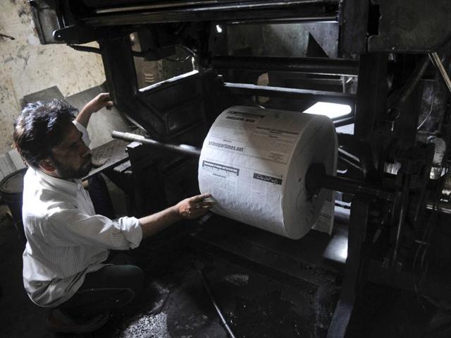 A worker checks the machinery at a printing press in Srinagar on Thursday. (Waseem Andrabi/HT photo) A worker checks the machinery at a printing press in Srinagar on Thursday. (Waseem Andrabi/HT photo)