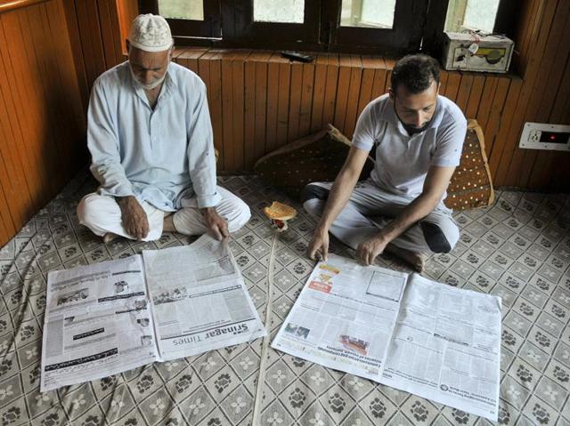 Kashmiri men read the morning newspaper in their house in Srinagar on Thursday. (Waseem Andrabi/HT photo) Kashmiri men read the morning newspaper in their house in Srinagar on Thursday. (Waseem Andrabi/HT photo)