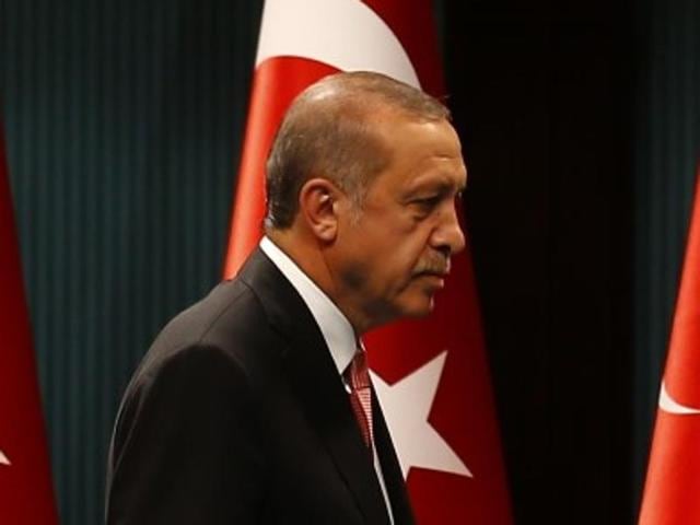 Turkish President Tayyip Erdogan leaves after a news conference following the National Security Council and cabinet meetings at the Presidential Palace in Ankara, Turkey, July 20, 2016. REUTERS/Umit Bektas Turkish President Tayyip Erdogan leaves after a news conference following the National Security Council and cabinet meetings at the Presidential Palace in Ankara, Turkey, July 20, 2016. REUTERS/Umit Bektas