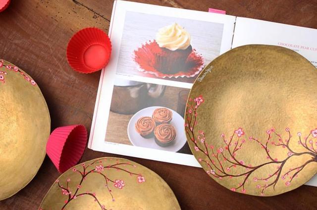 A set of brass plates with cherry blossoms designed for a Japanese dessert course. A set of brass plates with cherry blossoms designed for a Japanese dessert course.