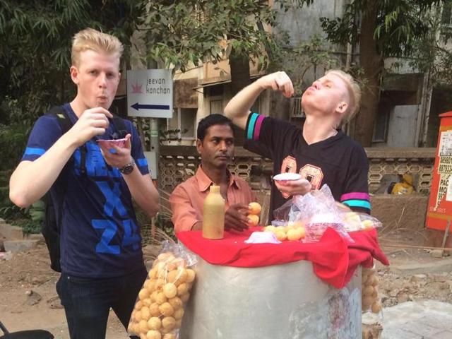 ‘One pani puri a day keeps the doctor away’, they believe. Despite four bouts of food poisoning each since they arrived, the two say they will never stop eating butter chicken, vada pavs or dosas off the streets. (facebook/2 Foreigners in Bollywood )