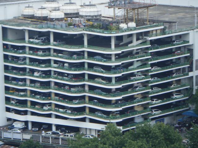 Stack parking is a form of multi-level parking in which cars can be placed on horizontal decks that can be moved vertically using hydraulic lifts.(HT PHOTO) Stack parking is a form of multi-level parking in which cars can be placed on horizontal decks that can be moved vertically using hydraulic lifts.(HT PHOTO)