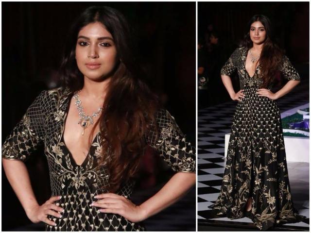 Bollywood actress Bhumi Pednekar extended support to the ace designer and sported a floor-length black jacket adorned with gold embellishments from the collection Epic Love. (Amal KS/ HT Photo) 