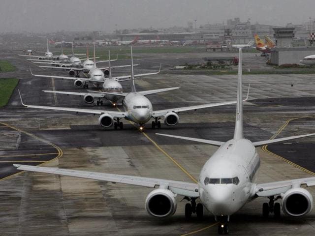 Aeroplanes lined up for take off at domestic airport on Tuesday. Plane servies hit by heavy rain and the runway was closed for half an hour for poor visibility resulting delay and chaos at the airport. HT photo by Vijayanand Gupta. 01-07-08