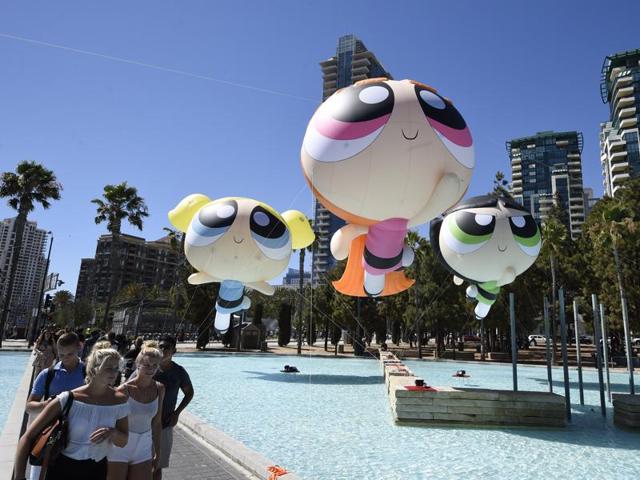 Fans walk past floating Cartoon Network Powerpuff Girls on day one of Comic-Con International held at the San Diego Convention Centre. (Denis Poroy/Invision/AP) Fans walk past floating Cartoon Network Powerpuff Girls on day one of Comic-Con International held at the San Diego Convention Centre. (Denis Poroy/Invision/AP)