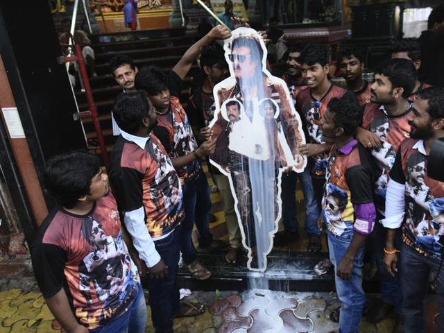 Rajinikanth fans pour milk on his cutout on the release of his film Kabali at Matunga Murugan Temple in Mumbai. (Photo by Arijit Sen/ Hindustan Times)