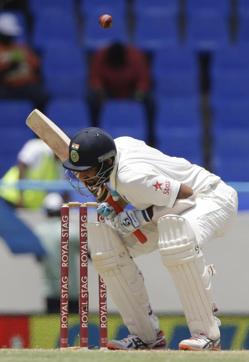West Indies' Shannon Gabriel tested India batsmen Shikhar Dhawan and Cheteshwar Pujara with short balls. (AP) West Indies' Shannon Gabriel tested India batsmen Shikhar Dhawan and Cheteshwar Pujara with short balls. (AP)