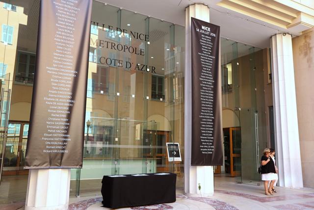 The names of the 84 victims killed in last week’s attack were listed on two black banners hung outside the building late Thursday. (AFP)