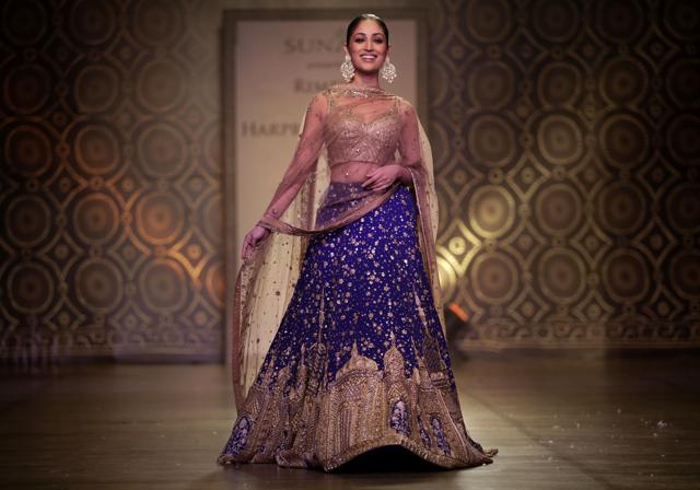 Yami Gautam displays a creation by designers Rimple &amp; Harpreet Narula at the India Couture Week 2016. (AP)
