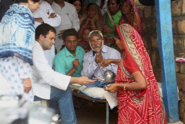 Congress vice-president Rahul Gandhi is served tea as he meets one of Dalit victims who were beaten up by cow protectors , at Una in Rajkot district on Thursday. (PTI) Congress vice-president Rahul Gandhi is served tea as he meets one of Dalit victims who were beaten up by cow protectors , at Una in Rajkot district on Thursday. (PTI)