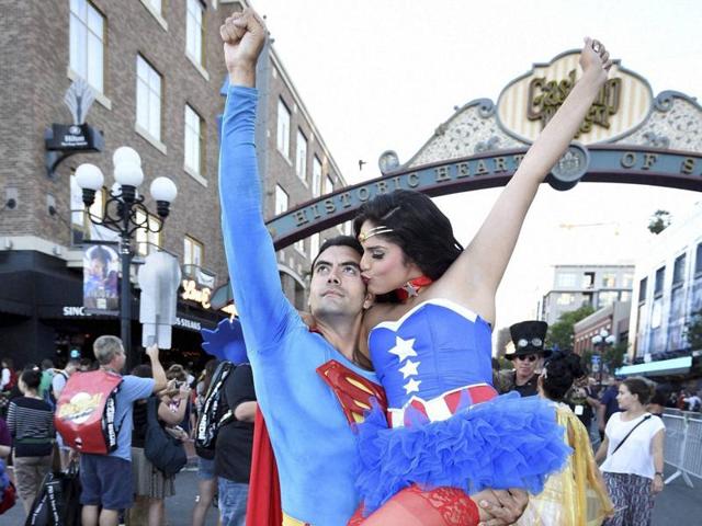 Sergio Valente, dressed as Superman, lifts Jessica Randall, dressed as Vixen, as she gives him a kiss outside of the convention centre on day one of Comic-Con International held at the San Diego Convention Centre. (AP) Sergio Valente, dressed as Superman, lifts Jessica Randall, dressed as Vixen, as she gives him a kiss outside of the convention centre on day one of Comic-Con International held at the San Diego Convention Centre. (AP)