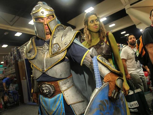 A foot soldier from the movie Warcraft guards the character Garona, centre, during Comic-Con International 2016. (AFP) A foot soldier from the movie Warcraft guards the character Garona, centre, during Comic-Con International 2016. (AFP)