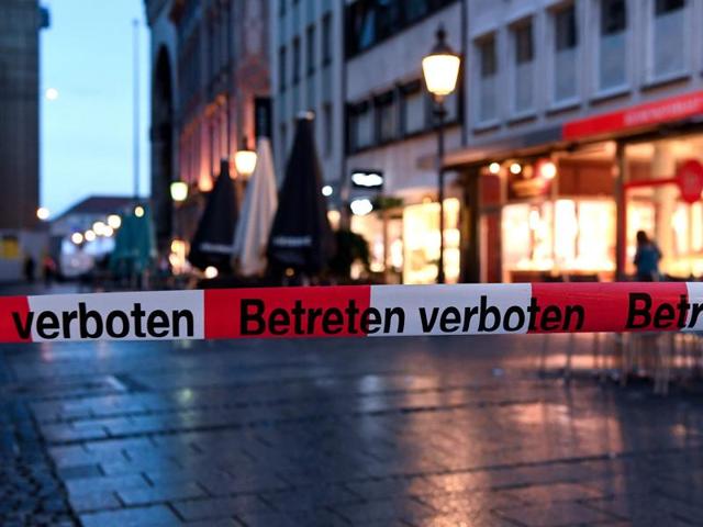 Police sign blocks the entrance to Odeon square following shootings at a shopping mall in Munich. (AFP) Police sign blocks the entrance to Odeon square following shootings at a shopping mall in Munich. (AFP)