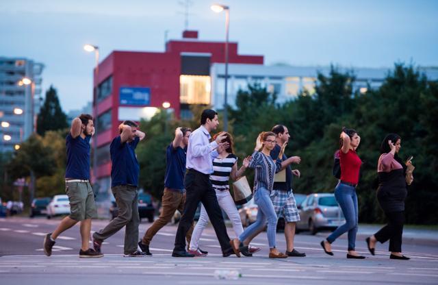 Evacuated people from the shopping mall walk with their hands up following a shooting in Munich. (AFP Photo) Evacuated people from the shopping mall walk with their hands up following a shooting in Munich. (AFP Photo)