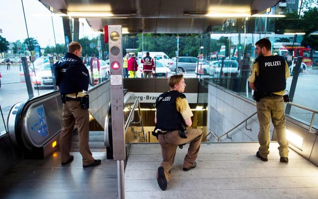 Police secures the entrance to a subway station near a shopping mall where a shooting took place, in Munich. (AFP Photo) Police secures the entrance to a subway station near a shopping mall where a shooting took place, in Munich. (AFP Photo)