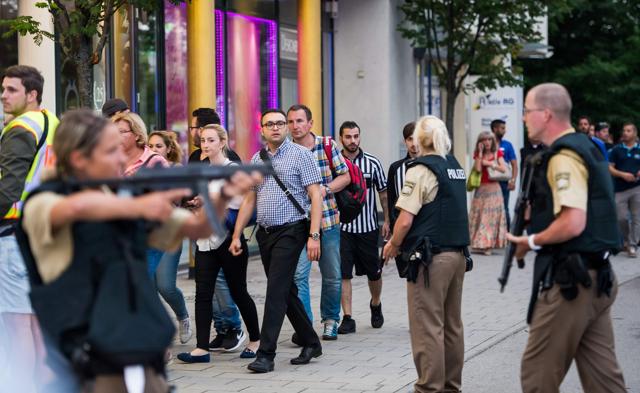 Police evacuate people from the shopping mall in Munich after the attack. (AFP) Police evacuate people from the shopping mall in Munich after the attack. (AFP)