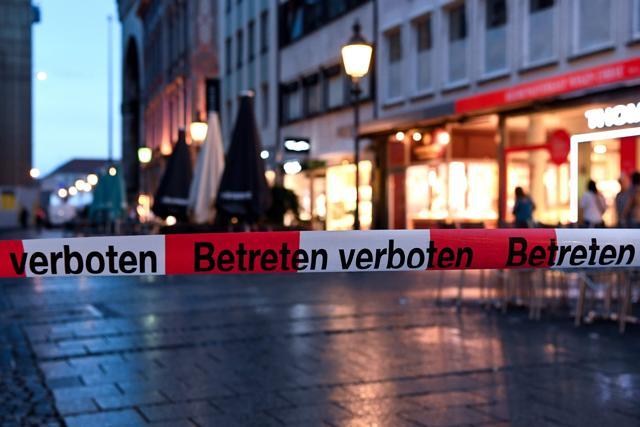 Police sign blocks the entrance to Odeon square following shootings at a shopping mall earlier on July 22, 2016 in Munich. Eight people were killed and several gravely injured on Friday in a shooting rampage at a Munich shopping centre, with the attackers still believed to be at large. (AFP) Police sign blocks the entrance to Odeon square following shootings at a shopping mall earlier on July 22, 2016 in Munich. Eight people were killed and several gravely injured on Friday in a shooting rampage at a Munich shopping centre, with the attackers still believed to be at large. (AFP)