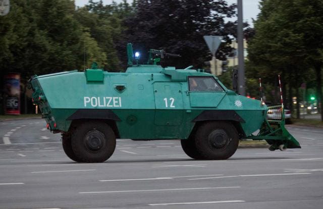A police vehicle is seen near a shopping mall (the Olympia Einkaufzentrum (OEZ) ) in Munich. (AFP Photo) A police vehicle is seen near a shopping mall (the Olympia Einkaufzentrum (OEZ) ) in Munich. (AFP Photo)