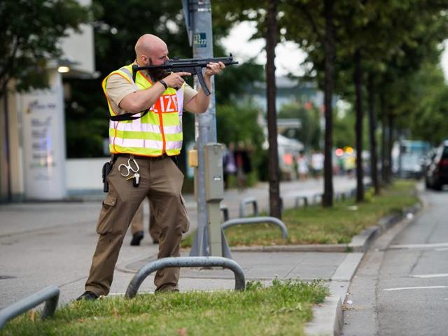 A policeman secures the area around a shopping mall in Munich on July 22, 2016 following a shooting earlier. At least eight persons have been killed and several wounded in a shooting at a shopping centre in Munich on Friday, German police said. (AFP) A policeman secures the area around a shopping mall in Munich on July 22, 2016 following a shooting earlier. At least eight persons have been killed and several wounded in a shooting at a shopping centre in Munich on Friday, German police said. (AFP)