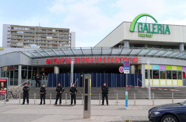 Police officers secure the area around a McDonald restaurant near the shopping mall Olympia Einkaufzentrum OEZ in Munich on July 23, a day after a gunman went on a shooting rampage, killing nine people. (AFP Photo) Police officers secure the area around a McDonald restaurant near the shopping mall Olympia Einkaufzentrum OEZ in Munich on July 23, a day after a gunman went on a shooting rampage, killing nine people. (AFP Photo)
