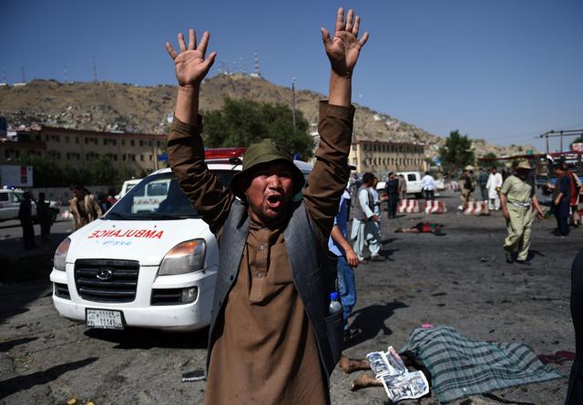 An Afghan protester screams near the scene of a suicide attack that targeted crowds of minority Shiite Hazaras during a demonstration. (AFP) An Afghan protester screams near the scene of a suicide attack that targeted crowds of minority Shiite Hazaras during a demonstration. (AFP)