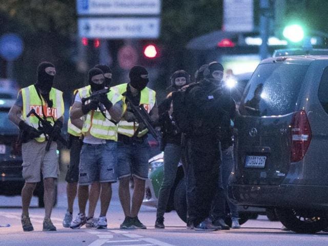 Special police forces prepare to search a neighbouring shopping centre outside the Olympia mall in Munich, southern Germany. (AP) Special police forces prepare to search a neighbouring shopping centre outside the Olympia mall in Munich, southern Germany. (AP)