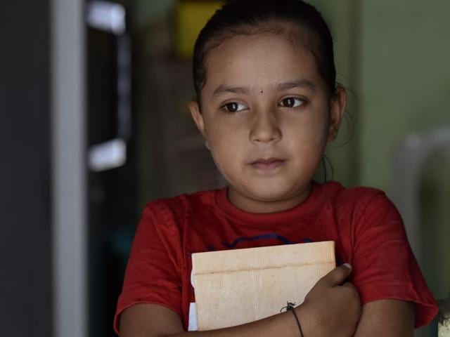 Refused admission to most schools in the western suburbs, Jia Dhulgaj, 8, had to stay in Nalasopara with her 90-year old grandmother. (Kunal Patil/HT photo) Refused admission to most schools in the western suburbs, Jia Dhulgaj, 8, had to stay in Nalasopara with her 90-year old grandmother. (Kunal Patil/HT photo)