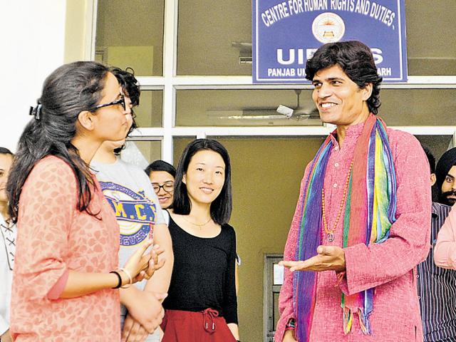 Transgender Dhananjay interacting with her classmates at the Centre for Human Rights and Duties at Panjab University, Chandigarh, on Friday.(Anil Dayal/HT Photo)