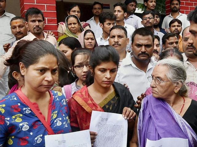 Expelled BJP leader Daya Shankar Singh's mother (R), wife Swati Singh (C) and others after filing a complaint against Mayawati and other BSP leaders at a police station, in Lucknow on Friday, July 22, 2016. The BJP will protest the ‘foul’ language used against Singh’s family by BSP. (PTI) Expelled BJP leader Daya Shankar Singh's mother (R), wife Swati Singh (C) and others after filing a complaint against Mayawati and other BSP leaders at a police station, in Lucknow on Friday, July 22, 2016. The BJP will protest the ‘foul’ language used against Singh’s family by BSP. (PTI)
