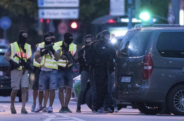 Special police forces prepare to search a neighbouring shopping centre outside the Olympia mall in after the shooting. (AP Photo) Special police forces prepare to search a neighbouring shopping centre outside the Olympia mall in after the shooting. (AP Photo)